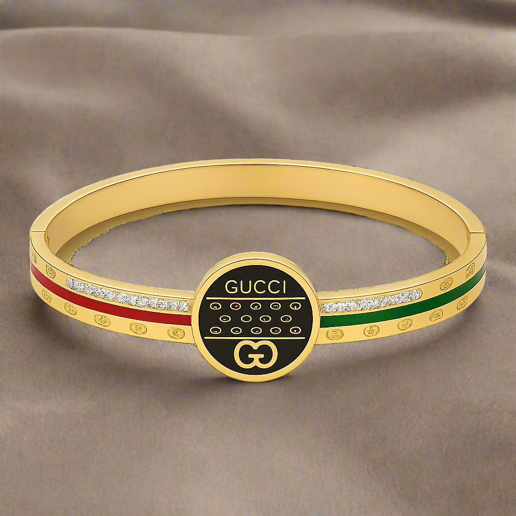 Gold bracelet with Gucci logo on a white background