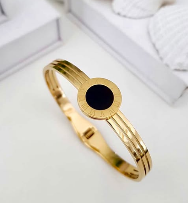 Gold bracelet with a black