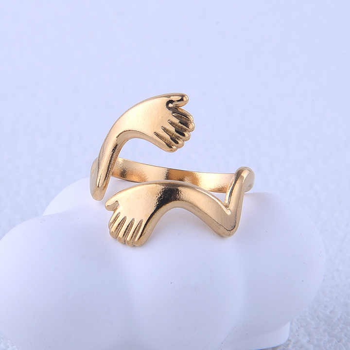 Gold ring with hand design