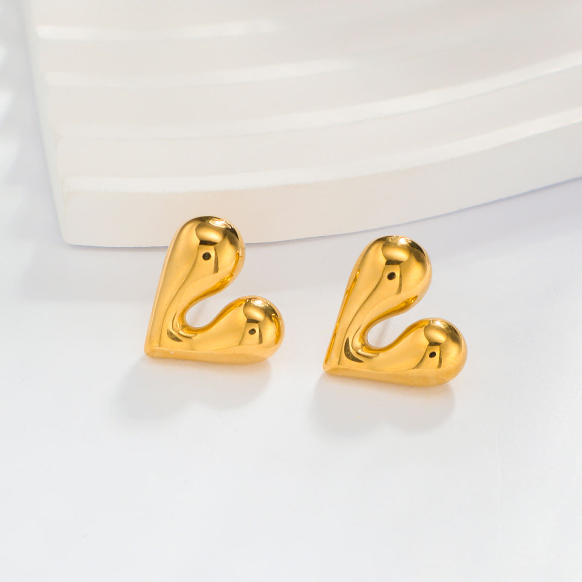 Gold heart earring