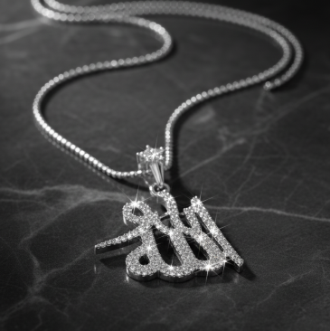 Silver necklace with a pendant on a dark marble surface