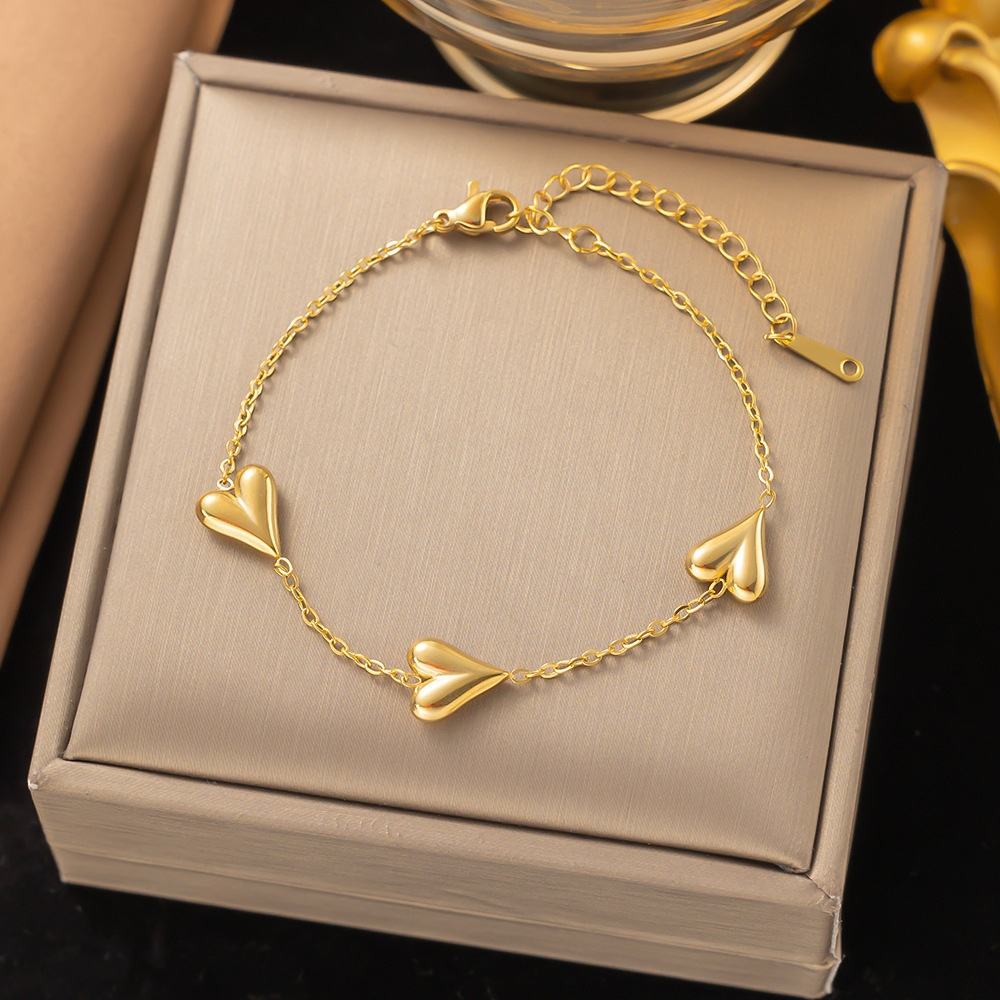 Gold bracelet with heart-shaped