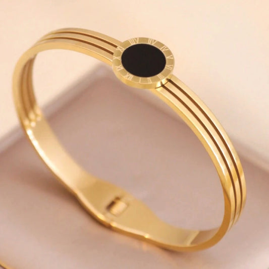 Gold bracelet with a black