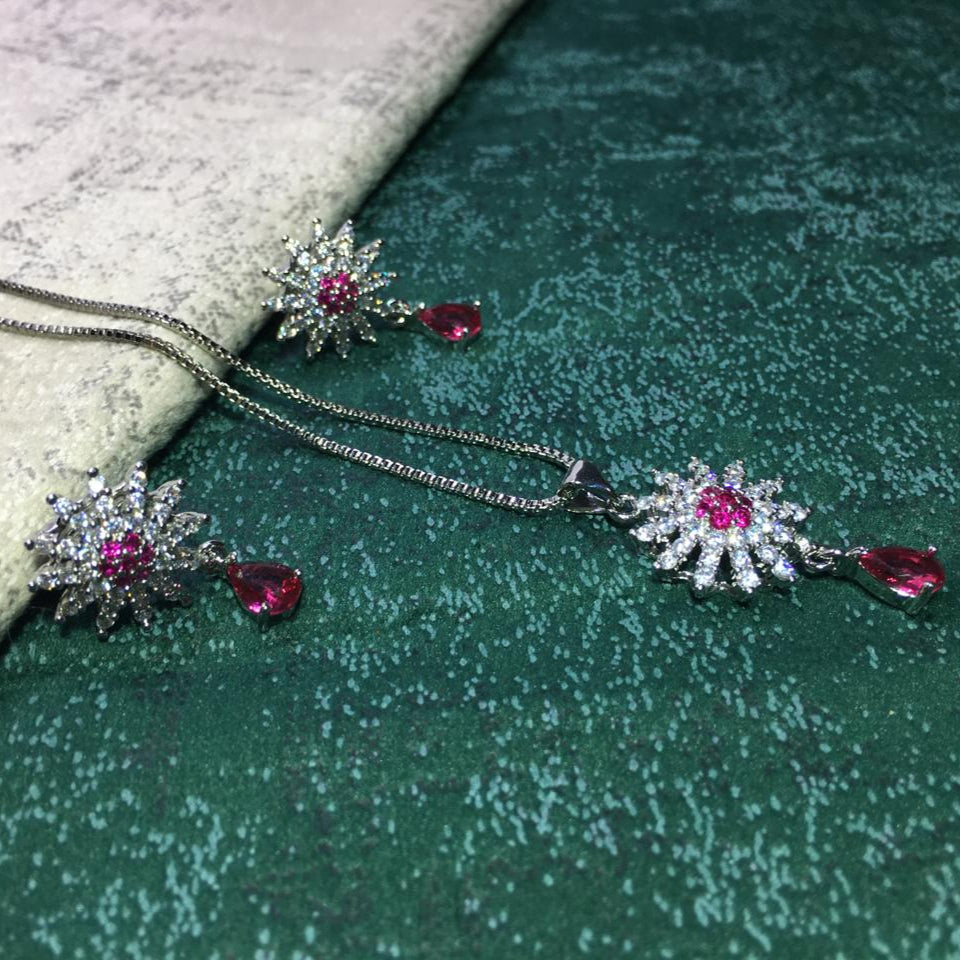  necklace and earrings with pink gemstones